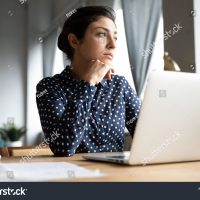 stock-photo-thoughtful-pensive-indian-unmotivated-employee-sit-at-workplace-desk-distracted-from-computer-work-1835827393